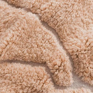 Minimalist Moroccan rug in a warm peach shade with modern geometric lines, perfect for Pinterest-inspired interiors. Handmade soft wool texture for cozy bedroom decor, stylish living rooms, or aesthetic content creator setups. This rug screams soft luxury, quiet comfort, and effortless viral style. Ideal for boho homes, apartment styling, and Instagram-worthy vibes.