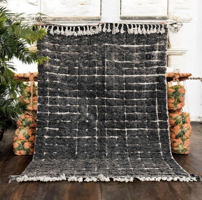 Soft peach Moroccan rug with light pink grid pattern, handcrafted by Berber artisans using 100% natural wool. Unique Boujad style with fluffy texture, ideal for cozy interiors, nurseries, boho bedrooms, and minimalist homes. Custom sizing available.