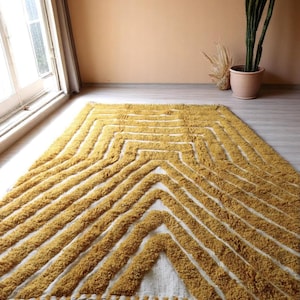 Yellow rug Handwoven rug Shaggy texture Moroccan style Geometric pattern Bohemian decor Cozy rug Soft texture Artisan rug Modern boho Statement piece Living room decor Bold design Striped rug Plush rug Warm tones Handmade rug Earthy colors Vintage