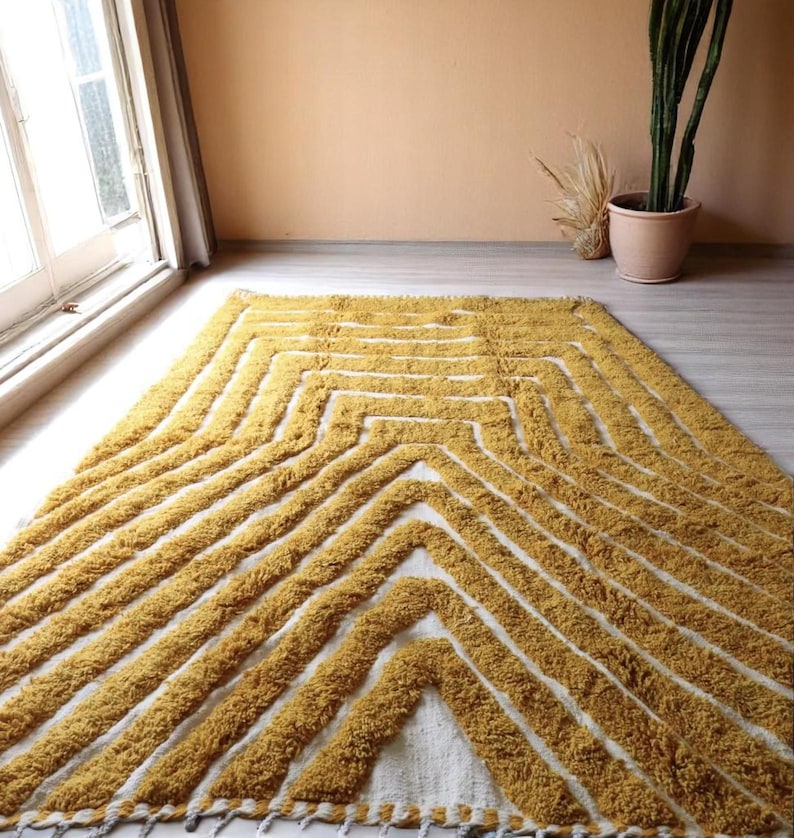 Yellow rug Handwoven rug Shaggy texture Moroccan style Geometric pattern Bohemian decor Cozy rug Soft texture Artisan rug Modern boho Statement piece Living room decor Bold design Striped rug Plush rug Warm tones Handmade rug Earthy colors Vintage