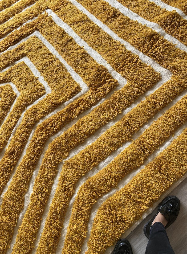 Yellow rug Handwoven rug Shaggy texture Moroccan style Geometric pattern Bohemian decor Cozy rug Soft texture Artisan rug Modern boho Statement piece Living room decor Bold design Striped rug Plush rug Warm tones Handmade rug Earthy colors Vintage