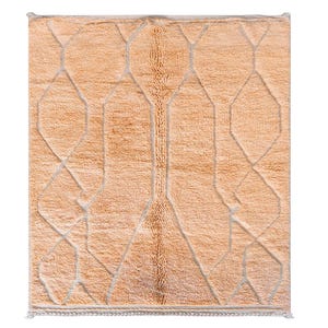 Minimalist Moroccan rug in a warm peach shade with modern geometric lines, perfect for Pinterest-inspired interiors. Handmade soft wool texture for cozy bedroom decor, stylish living rooms, or aesthetic content creator setups. This rug screams soft luxury, quiet comfort, and effortless viral style. Ideal for boho homes, apartment styling, and Instagram-worthy vibes.