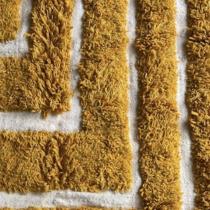 Yellow rug Handwoven rug Shaggy texture Moroccan style Geometric pattern Bohemian decor Cozy rug Soft texture Artisan rug Modern boho Statement piece Living room decor Bold design Striped rug Plush rug Warm tones Handmade rug Earthy colors Vintage