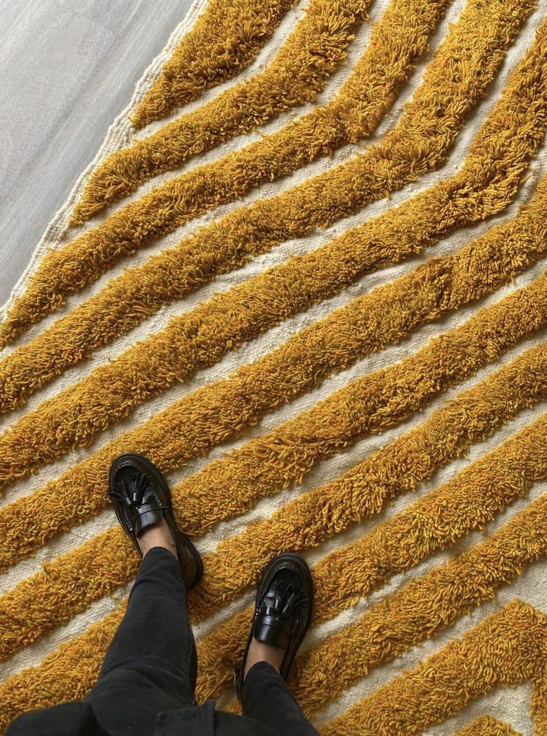 Yellow rug Handwoven rug Shaggy texture Moroccan style Geometric pattern Bohemian decor Cozy rug Soft texture Artisan rug Modern boho Statement piece Living room decor Bold design Striped rug Plush rug Warm tones Handmade rug Earthy colors Vintage