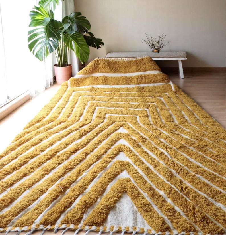 Yellow rug Handwoven rug Shaggy texture Moroccan style Geometric pattern Bohemian decor Cozy rug Soft texture Artisan rug Modern boho Statement piece Living room decor Bold design Striped rug Plush rug Warm tones Handmade rug Earthy colors Vintage
