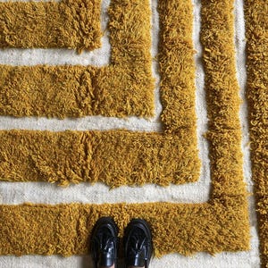 Yellow rug Handwoven rug Shaggy texture Moroccan style Geometric pattern Bohemian decor Cozy rug Soft texture Artisan rug Modern boho Statement piece Living room decor Bold design Striped rug Plush rug Warm tones Handmade rug Earthy colors Vintage