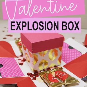 May include: A DIY Cricut Valentine Explosion Box, open to reveal red and pink paper elements, gold foil accents, and small sweets. The box is pink with gold lip print designs. Text on the box reads "DIY Cricut Valentine Explosion Box."