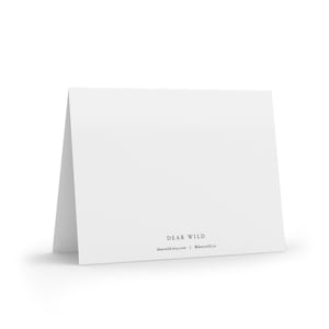 May include: Blank white card with the text "DEAR WILD" and the website address "dearwild.etsy.com" and the social media handle "@dearwild.co" printed on the bottom.