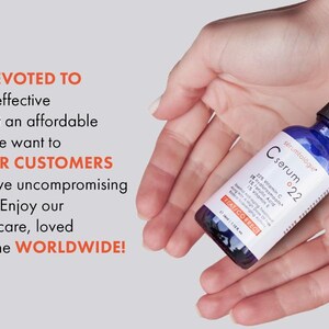 May include: A blue serum bottle with a black dropper is held in open hands. The bottle has a white label with text that reads "C serum 22". The text "We are devoted to providing effective products" is also visible.