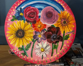 Pintura de flores sobre madera.