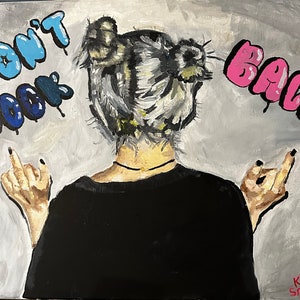 May include: A painting of a person with their back to the viewer, with their middle fingers raised. The person has grey hair in two buns. The background is grey with the words "Don't Look Back" in blue and pink.