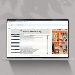 May include: A laptop displaying a decluttering dashboard with a weekly checklist. The screen shows a spreadsheet with categories like kitchen, bathroom, and home office. A colorful closet is visible on the right side of the screen. The laptop is on a white shelf.