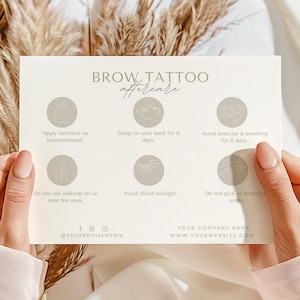May include: A white card with the text "BROW TATTOO aftercare" in brown lettering. The card lists six aftercare instructions for brow tattoos, including applying ointment, sleeping on your back, avoiding exercise and sweating, avoiding direct sunlight, and not picking or scratching the area.