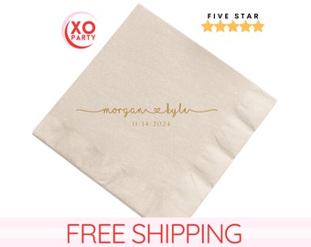 May include: Beige paper napkin with gold text that reads "morgan ♥ kyle" and "11.14.2024".