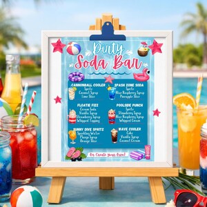May include: A white easel displays a "Dirty Soda Bar" menu with colorful drink illustrations. The menu features drink names like "Cannonball Cooler" and "Poolside Punch," with ingredients listed below each. Beach-themed decorations surround the menu.