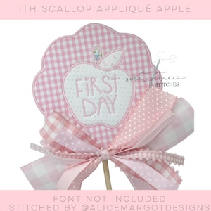 May include: Pink and white gingham apple applique with the text "FIRST DAY" in white embroidery. The apple is attached to a pink and white gingham ribbon bow.