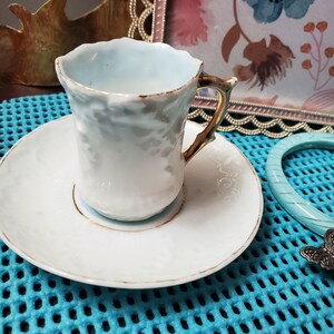 Vintage Dematasy Teacup & Saucer: White Porcelain with Blue Accents