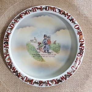 Child&#39;s Feeding Dish Charlie & Charlotte Porcelain with children lost and officer helping them get home. Made in &quot;Germany 234&quot; on the bottom