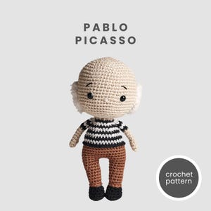 May include: Crochet pattern for a plush toy of Pablo Picasso, a famous artist. The toy is beige with black and white striped shirt and brown pants. The toy has a white beard and black eyes.