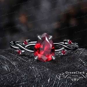 Gothic pear cut ruby engagement ring Art Deco black gold twist promise ring Nature inspired red gemstone leaf ring Unique handmade jewelry