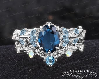 Unique oval cut London blue topaz engagement ring sets Art deco leaf promise ring Nature inspired 14k white gold bridal sets Jewelry gifts