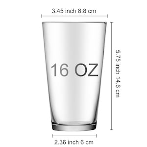 May include: A clear glass 16 oz. drinking glass with measurements in inches and centimeters.