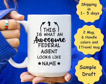 May include: White ceramic mug with the text "THIS IS WHAT AN Awesome FEDERAL AGENT LOOKS LIKE *NAME*". The mug has a curved handle and black text. The image also includes text about the product.