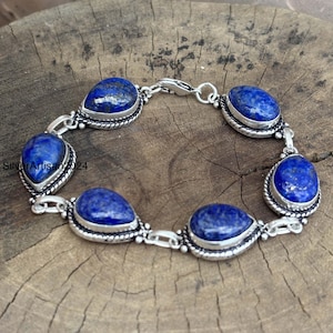 May include: A set of three ceramic mugs with a speckled, matte finish. The mugs are in shades of cream, light gray, and dark gray. Each mug has a simple, minimalist design and a rounded handle.