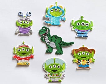 Insignias de dinosaurio alienígena de Toy Story para planchar y coser