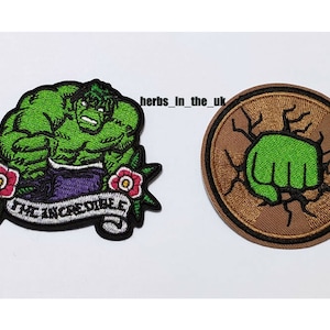May include: Two embroidered iron-on patches featuring the Incredible Hulk. One patch shows the Hulk's face and the words "The Incredible Hulk". The other patch shows the Hulk's fist breaking through a wall.