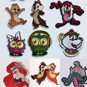 Puede incluir: Un conjunto de 10 parches bordados para planchar con diferentes personajes de dibujos animados, incluyendo Chip y Dale, un búho con auriculares, una tetera, una sirena y una bruja del mar morada.