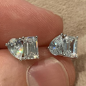 2.0 Carat Toi et moi Pear and emerald Cut Lab Diamond Earrings: Platinum Plated Sterling Silver