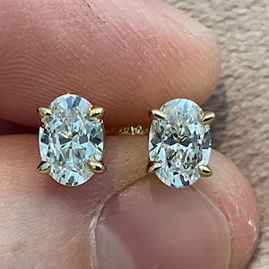 2.0 carat Lab Created diamond oval cut set in 925 Sterling silver and gold plated overlay hallmarked.