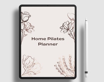 May include: A digital tablet with a white background and black frame. The screen displays a floral design with the text "Home Pilates Planner".