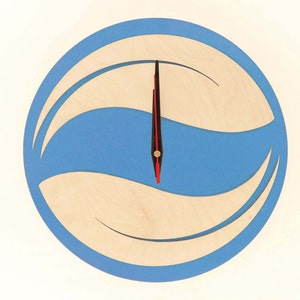 May include: A blue and beige wooden clock with a wave design. The clock has a red hour hand and a black minute hand.