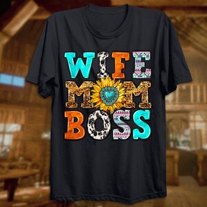 May include: Black t-shirt with the text "Wife Mom Boss" in colourful letters with a sunflower and cow print design.