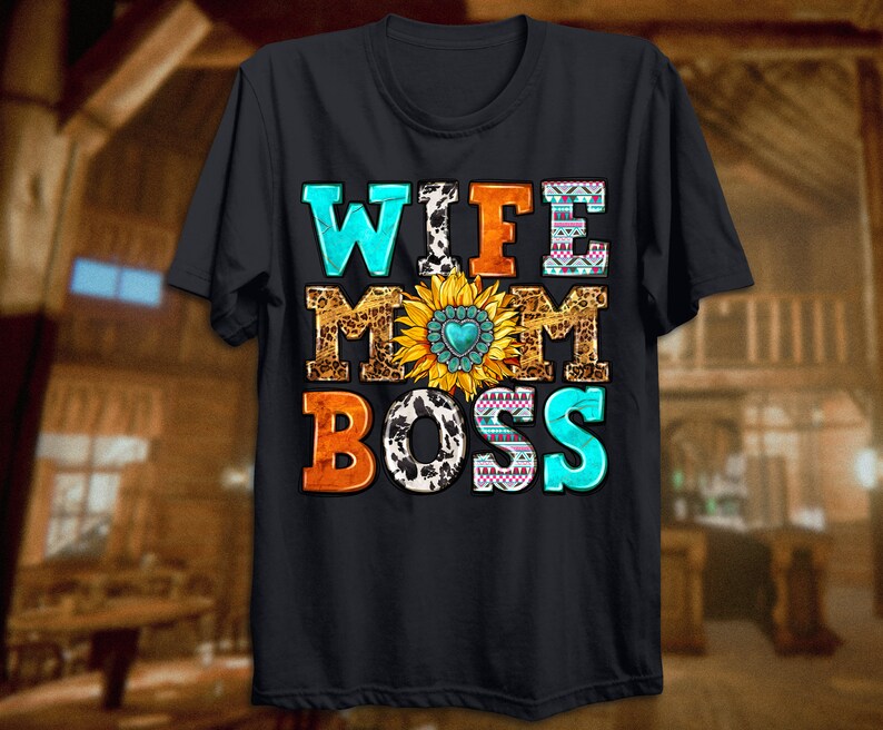 May include: Black t-shirt with the text "Wife Mom Boss" in colourful letters with a sunflower and cow print design.