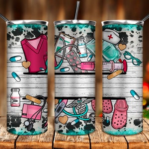 May include: Three stainless steel tumblers with a white woodgrain background and colorful medical illustrations. The tumblers feature a nurse's cap, stethoscope, pills, bandages, and a pair of pink clogs.