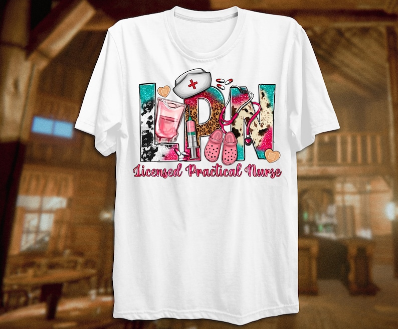May include: White t-shirt with a colorful graphic design that says "LPN Licensed Practical Nurse". The graphic includes a stethoscope, a nurse's cap, a syringe, a bottle of liquid, and a pair of pink clogs.
