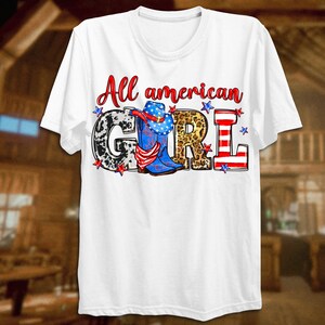 May include: White t-shirt with the text "All american GIRL" in red, white, and blue. The letters are decorated with cow print, leopard print, and stars.