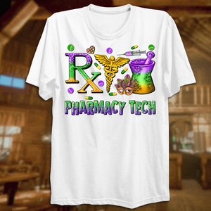 May include: White t-shirt featuring a colorful design with the text "Rx PHARMACY TECH". The design includes a caduceus, mortar and pestle, pills, and a Mardi Gras mask. The letters "Rx" are in purple and green.