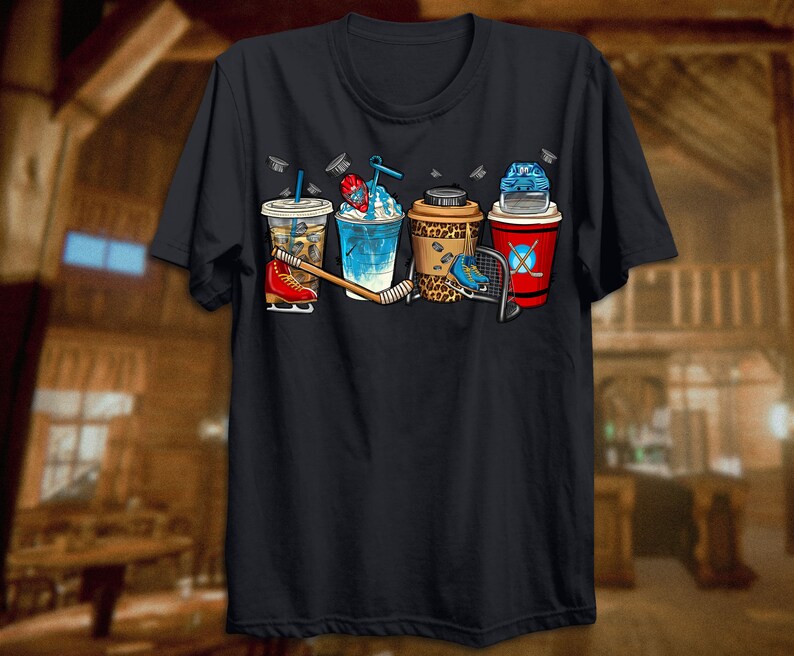May include: Black t-shirt with a graphic of five different beverages, including a coffee, iced coffee, slushie, and two beers. The graphic also includes a hockey stick and a hockey skate.