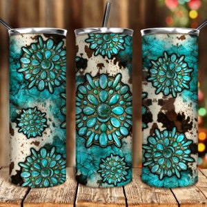May include: A set of three stainless steel tumblers with a turquoise and brown design. The tumblers feature a turquoise cracked background with a cowhide pattern and turquoise gemstone embellishments. Each tumbler has a black straw.