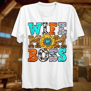 May include: White t-shirt with the text "Wife Mom Boss" in colourful letters with a sunflower and other patterns.
