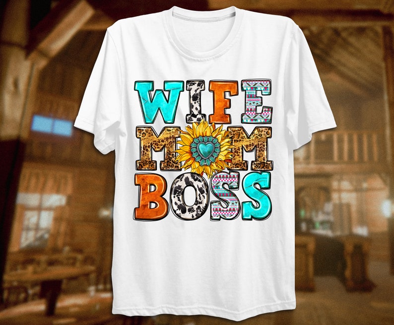 May include: White t-shirt with the text "Wife Mom Boss" in colourful letters with a sunflower and other patterns.