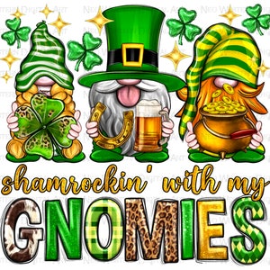 May include: Three gnomes dressed in green and gold for St. Patrick's Day. The gnome on the left is holding a shamrock, the gnome in the middle is holding a horseshoe and a beer, and the gnome on the right is holding a pot of gold. The text "shamrockin' with my GNOMIES" is below the gnomes.