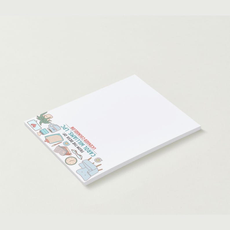 May include: White notepad with a decorative border featuring small illustrations of office-related items. Text on the notepad reads "FROM THE DESK OF: CAROL WILLIAMS, LPC LICENSED COUNSELOR."