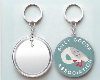 Llavero/Pin de botón de animal de la Asociación del Ganso Tonto