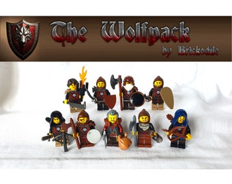 May include: A group of eight minifigures dressed as medieval warriors, each with unique weapons and armor. The figures are arranged in a semi-circle on a white surface. The title "The Wolfpack by Brickodile" is displayed above the figures.