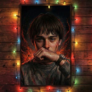 May include: A framed art print featuring a young person with a distressed expression, covering their mouth. The artwork has a dark, dramatic color palette with fiery red and orange accents. The person wears a watch with a brown leather strap. The frame is surrounded by colorful string lights.